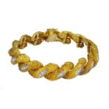 An 18 carat yellow gold and diamond bracelet,