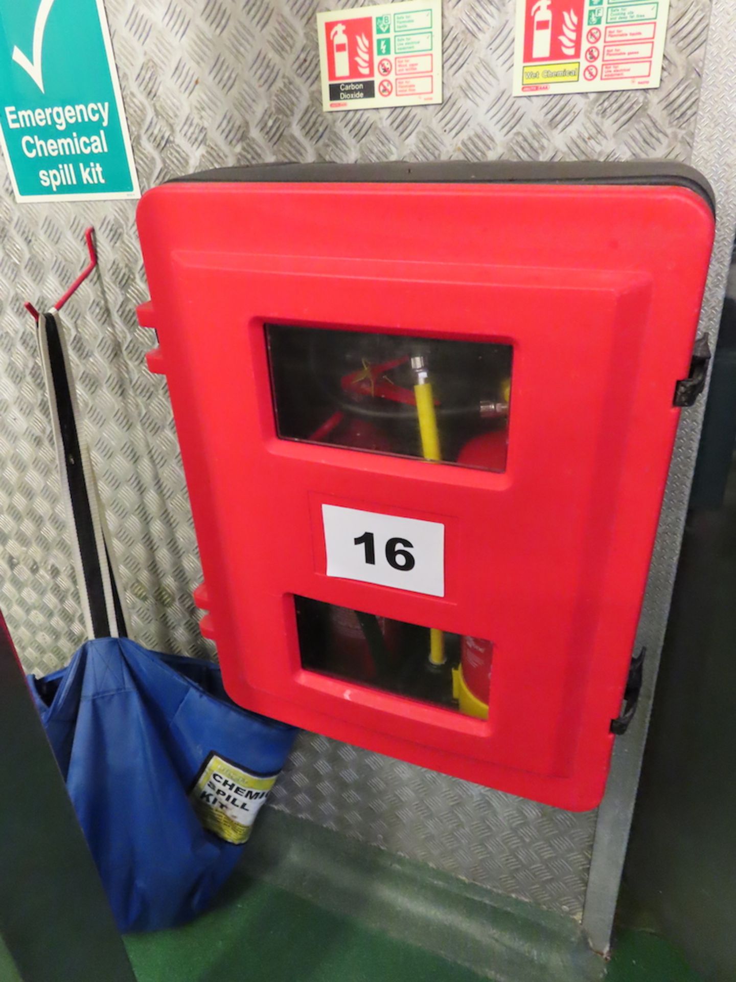 WALL MOUNTED FIRE EXTINGUISHER HOLDER.