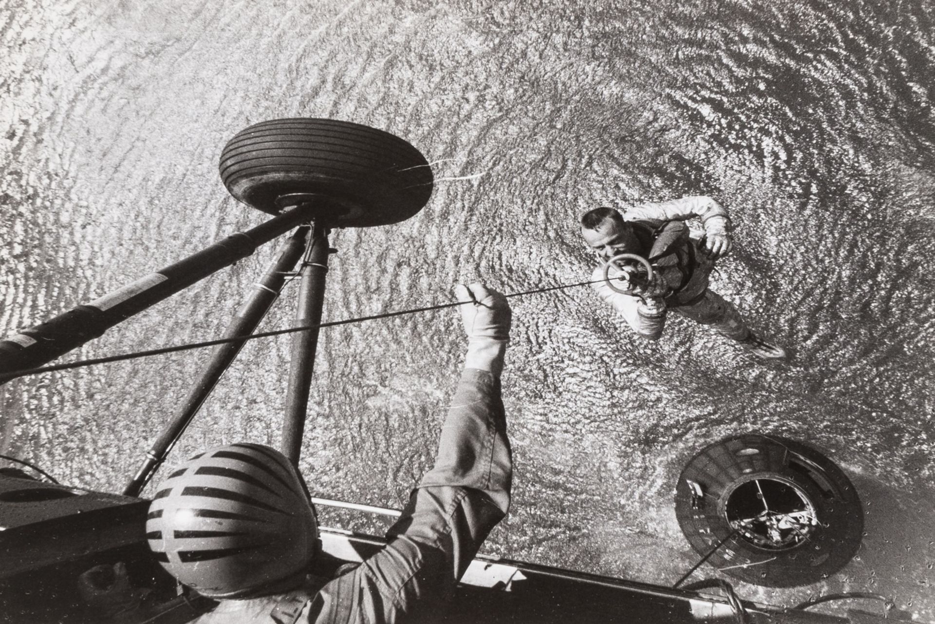 Alan Shepard, the first American in space, winched aboard a helicopter after splashdown, 5 May …