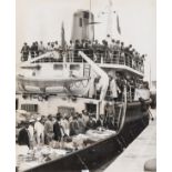 Windrush.- 16 press photographs documenting the arrival of the Windrush generation of West Indian …