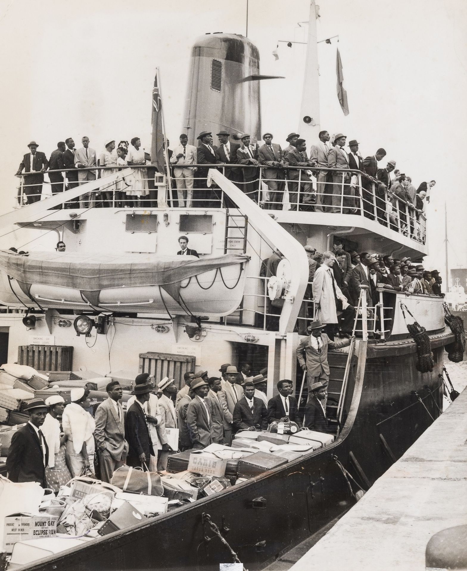 Windrush.- 16 press photographs documenting the arrival of the Windrush generation of West Indian …