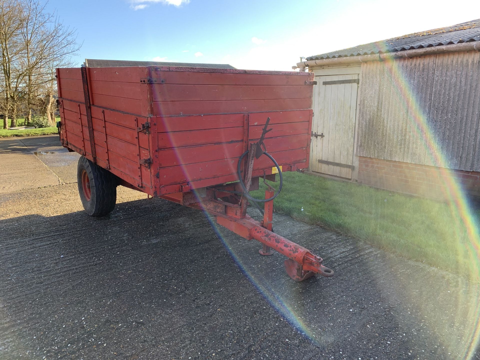 Tye single axle grain trailer with wooden sides and extensions