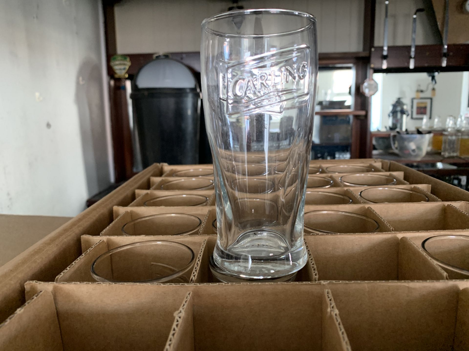 Box of Carling half pint glasses