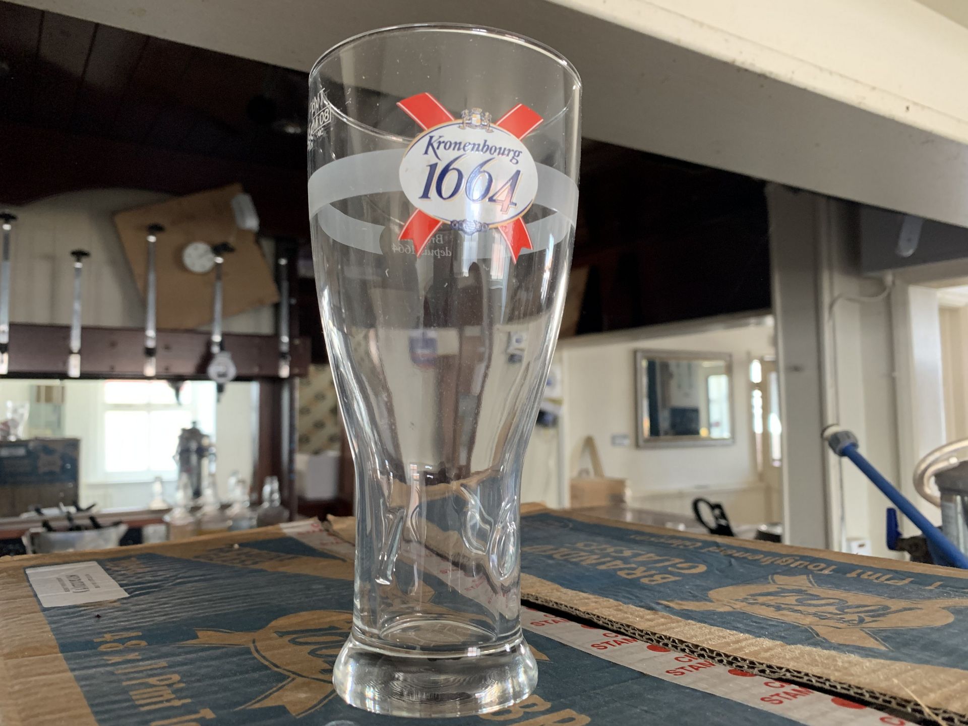 Box of Kronenburg pint glasses