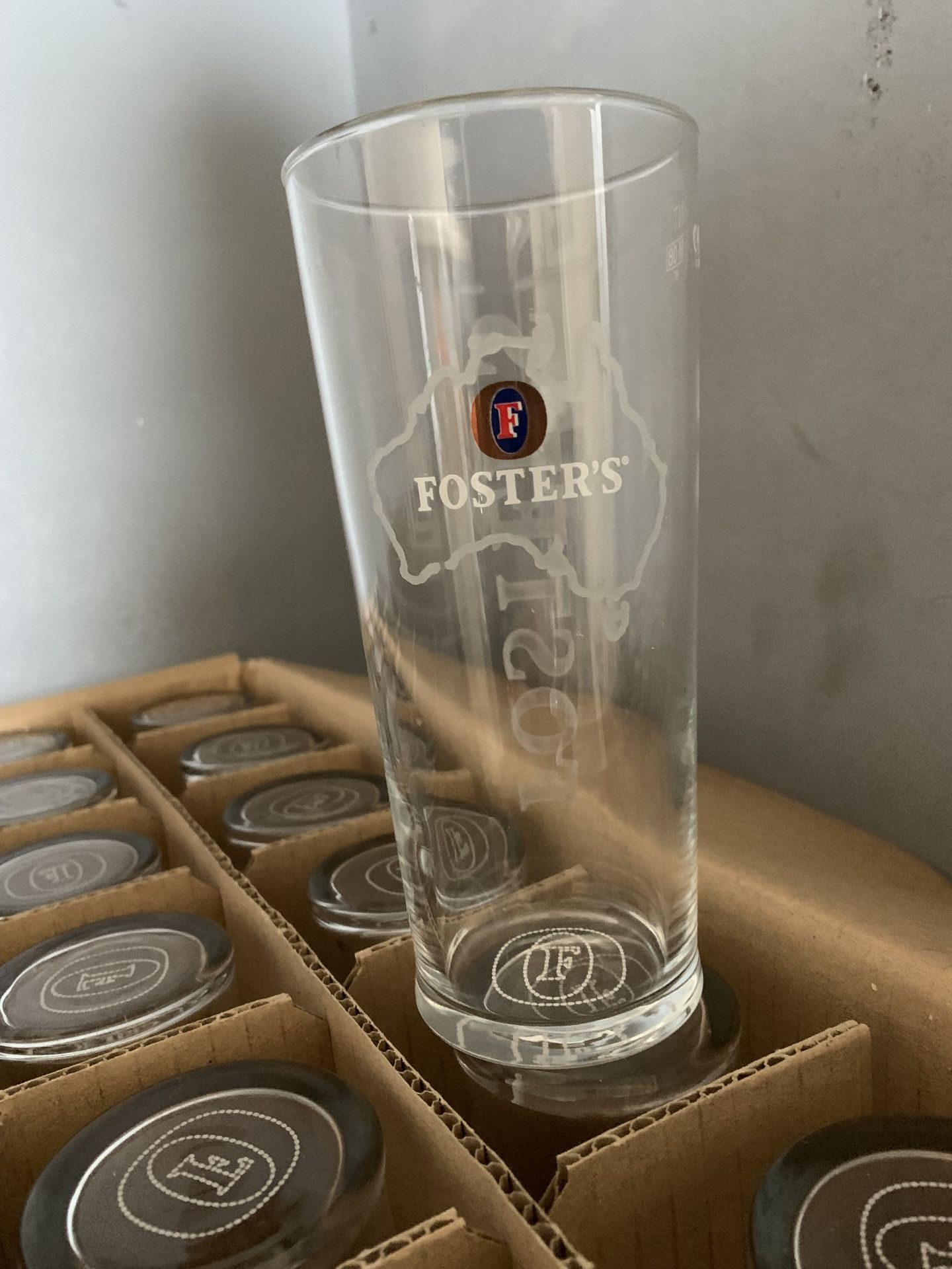 Box of Fosters pint glasses