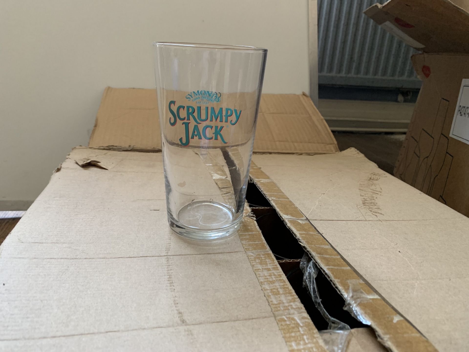 Box of Scrumpy Jack pint glasses