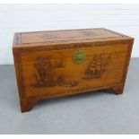 Camphor wood blanket box / storage trunk, with hinged lid and void interior, carved with a pagoda