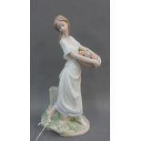Lladro Privilege society 2004 figure of a girl with a basket of flowers, 26cm high