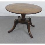 Early 19th century oak table, the circular top raised on quadruple legs, 61 x 78cm