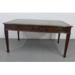 Mahogany veneered writing desk with inset green leather skivver and three frieze drawers, on