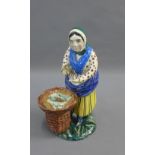 Early 19th century earthenware figure of a fishwife, probably from Thomas Rathbone's factory,