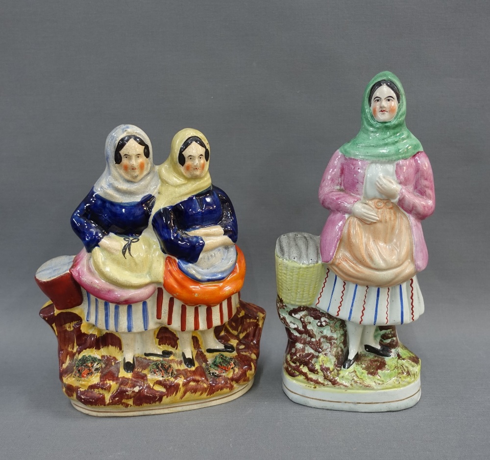 Two Scottish pottery fishwife figure groups, on oval gilt lined bases, tallest 24cm high (2)