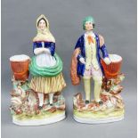 Pair of 19th century flatback fish seller figures, on oval gilt lined bases, 35cm (2)