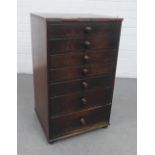 Small 19th century mahogany chest, with nine graduating long drawers with bun handles, 57 x 40cm