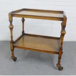 Walnut two tier trolley, on castors, 73 x 67cm