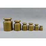 Set of six brass weights, ranging from 50 grams to 1kg, (6)