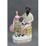 Eva & Uncle Tom, a 19th century Staffordshire flatback figure, on oval lined base, 23cm high