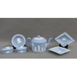 Collection of pale blue Wedgwood jasper ware to include a teapot, trinket dishes and two boxes, (6)