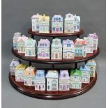 Set of twenty three Brooks & Bentley condiment and spice jars, modelled as house and contained on