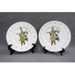 A pair of Fiona Mackechnie porcelain plates with scarecrow pattern, 27cm diameter 92)