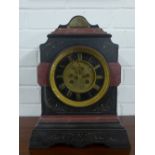 Victorian black slate and red hardstone mantle clock with ebonised chapter ring with gilded Roman