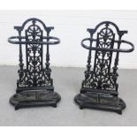 A pair of black painted metal stick stands, likely reproductions, 54 x 31cm (2)