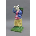 Early 19th century earthenware figure of a fishwife, probably from Thomas Rathbone's factory,