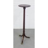 Mahogany torchere with a circular dished top, on tripod base, 107 x 28cm