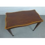 Early 20th century mahogany table with satinwood border, on tapering legs with spade feet and