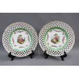 Pair of continental porcelain cabinet plates with reticulated rims and painted with figures, each