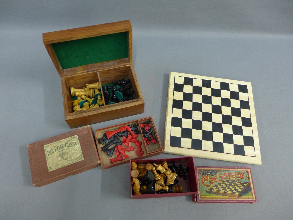 A wooden chess board and three sets of chessmen, etc
