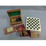 A wooden chess board and three sets of chessmen, etc