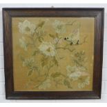 Oak framed needlework panel depicting a bird, flowers and foliage, size overall 51 x 54cm