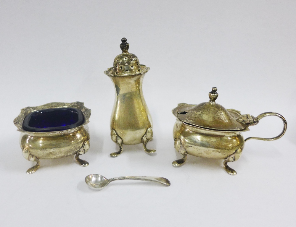 George V silver condiment set comprising pepper, salt and mustard with blue glass liners, Birmingham