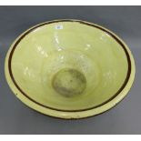 Yellow glazed terracotta bowl, 50cm diameter (hairline to the glaze)