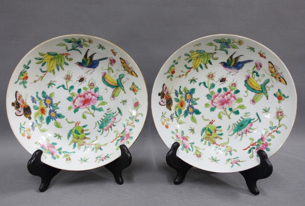 A pair of Chinese dishes with butterfly, insects and birds pattern, with a red seal mark to the