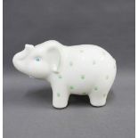 Tiffany & Co, green and white glazed pottery money bank in the form of an elephant, 25cm long