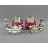 Silver condiments to include a pair of silver pepper pots, Birmingham 1908, mustard pot with clear