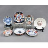 Fourteen various Chinese saucer dishes, largest 14cm