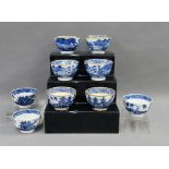 A collection of nine Chinese blue and white tea bowls, mostly with pagoda and landscape patterns, (