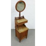 Early 20th century oak bedside cabinet with a circular mirror to top, 145 x 40cm