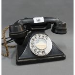 A vintage black Bakelite telephone, base number G.O - 1