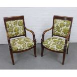A pair of French Empire style open armchairs with floral upholstered backs and seat, with dolphin