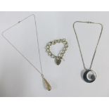 Newbridge silverware pendant on chain, silver pierced pear shape pendant and chain and a silver