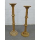 Two pine pedestal columns with circular tops and spiral stems, tallest 101cm (2)