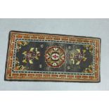 Runner with black field and central foliate medallion, with geometric border, 76 x 153cm