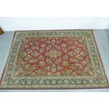 Eastern rug, rust field with allover foliate pattern and flowerhead border, 280 x 200cm