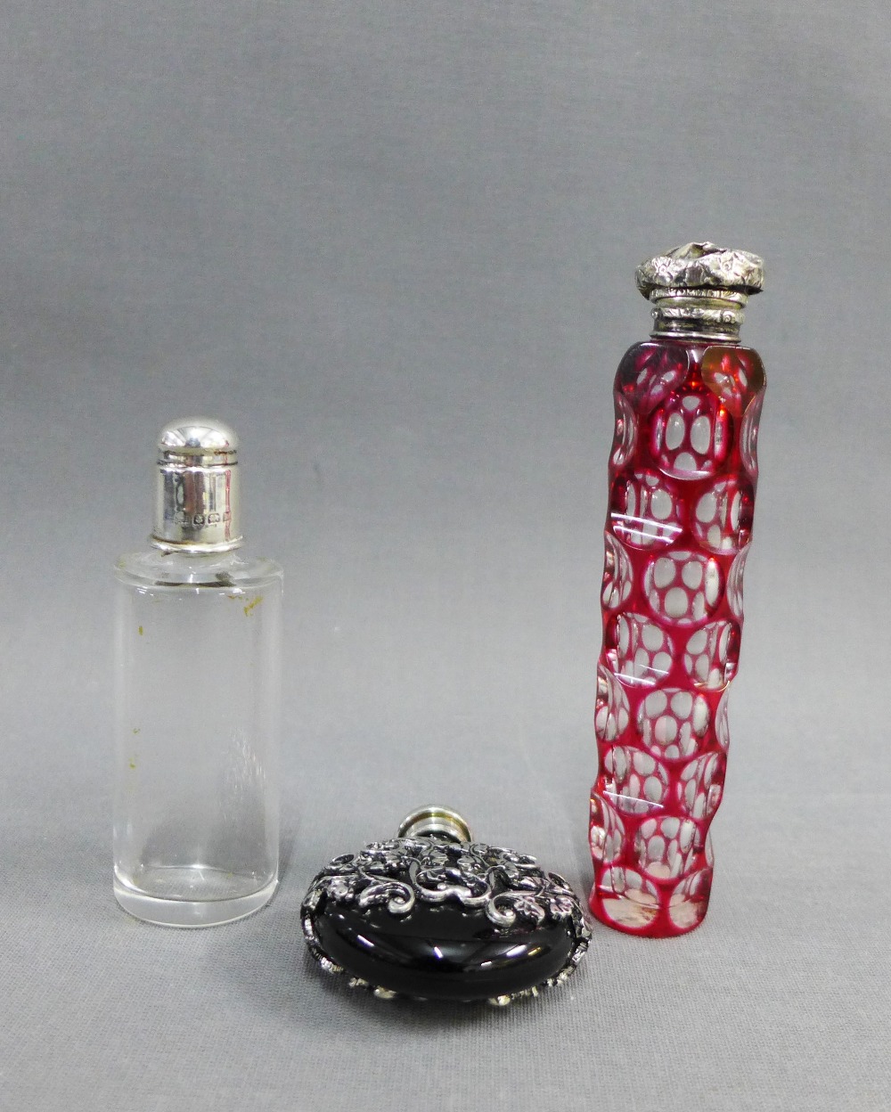 Ruby flashed glass scent bottle with white metal top together with two others tallest 12cm (3)