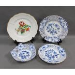Two Meissen blue and white plates and a Meissen bowl, all with reticulated rims and blue crossed