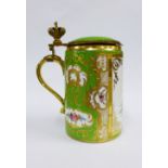 Late 19th / early 20th century gilt metal mounted porcelain tankard, painted with figures in a